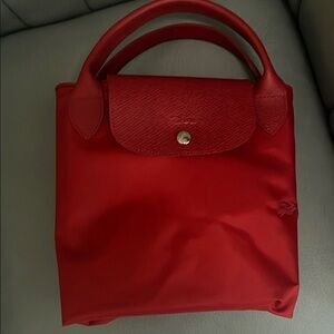 Longchamp Red Bag
Folds up as seen in picture